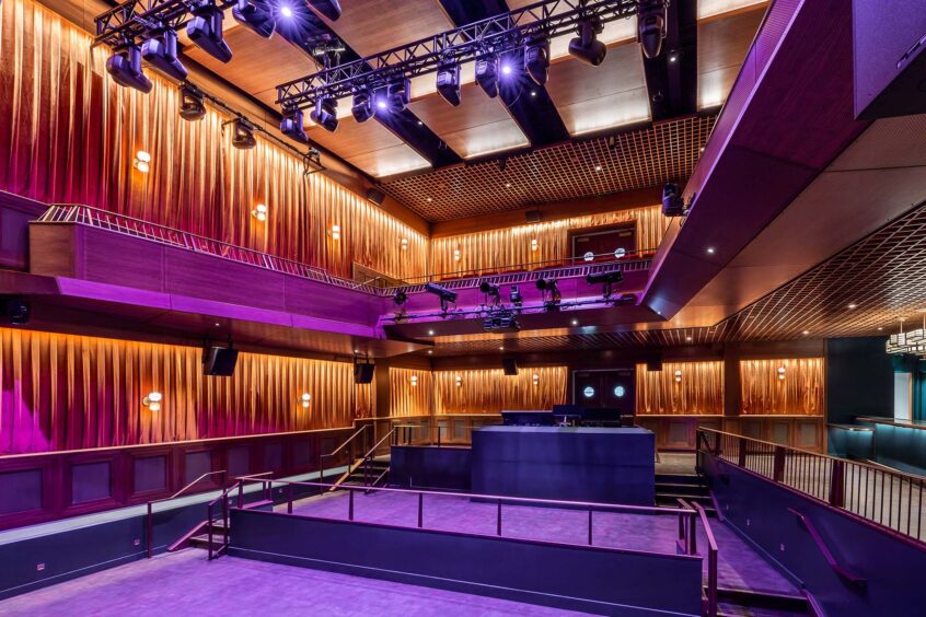 A theater with extensive wood paneling